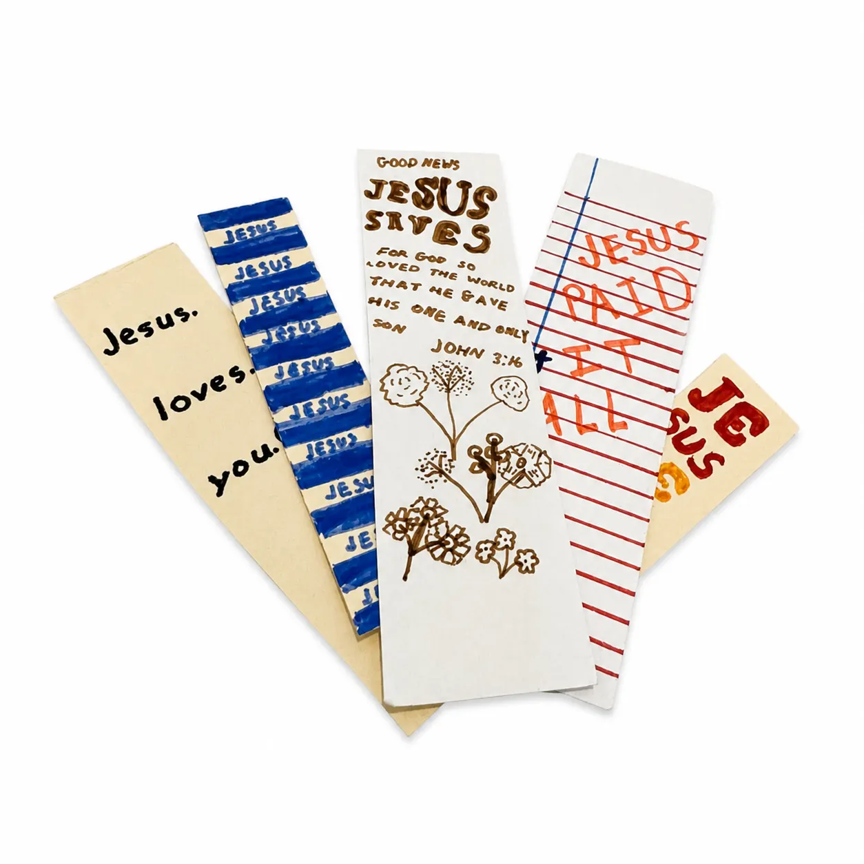 Five hand-made bookmarks fanned out on white: Jesus Loves You in black marker on cream, blue-striped Jesus repeated in blue, Good News Jesus Saves in brown marker with hand-drawn flowers, Jesus Paid It All in red marker on lined notebook paper, and Jesus repeated in red, orange, yellow, and green.