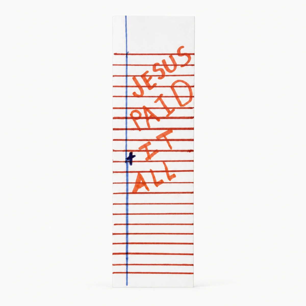 A bookmark cut from notebook paper, with Jesus Paid It All hand-lettered in red marker across the ruled lines and a small blue cross on the margin.